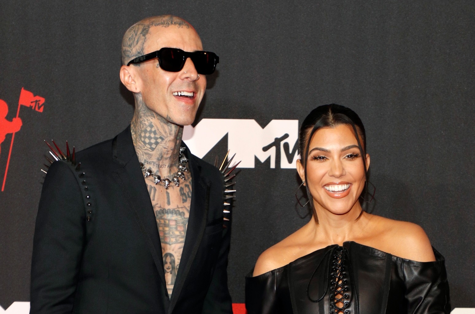Travis Barker & Kourtney Kardashian Make Skulls Seem Romantic With